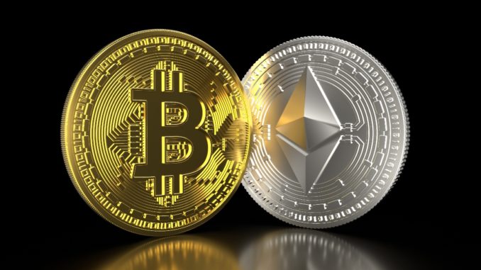 Picture of a gold bitcoin and a silver Ethereum standing next to each other